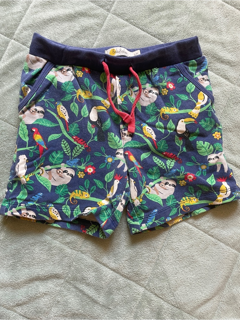 Baby Boden Navy Tropical Sloth & Parrot Shorts with Red Drawstring